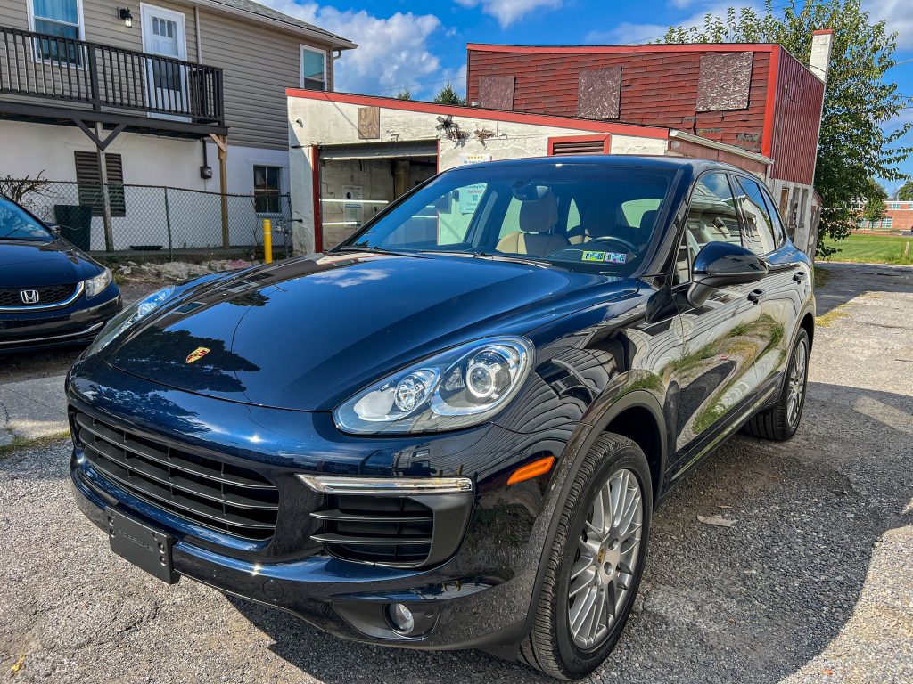 Dark blue SUV in York PA at Teddys Detail for professional ceramic coating application in-shop