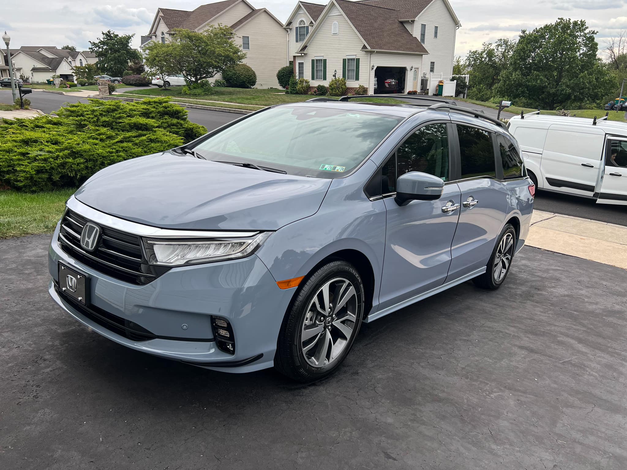 Honda minivan receiving ceramic coating on a driveway in York, PA during a mobile detailing service